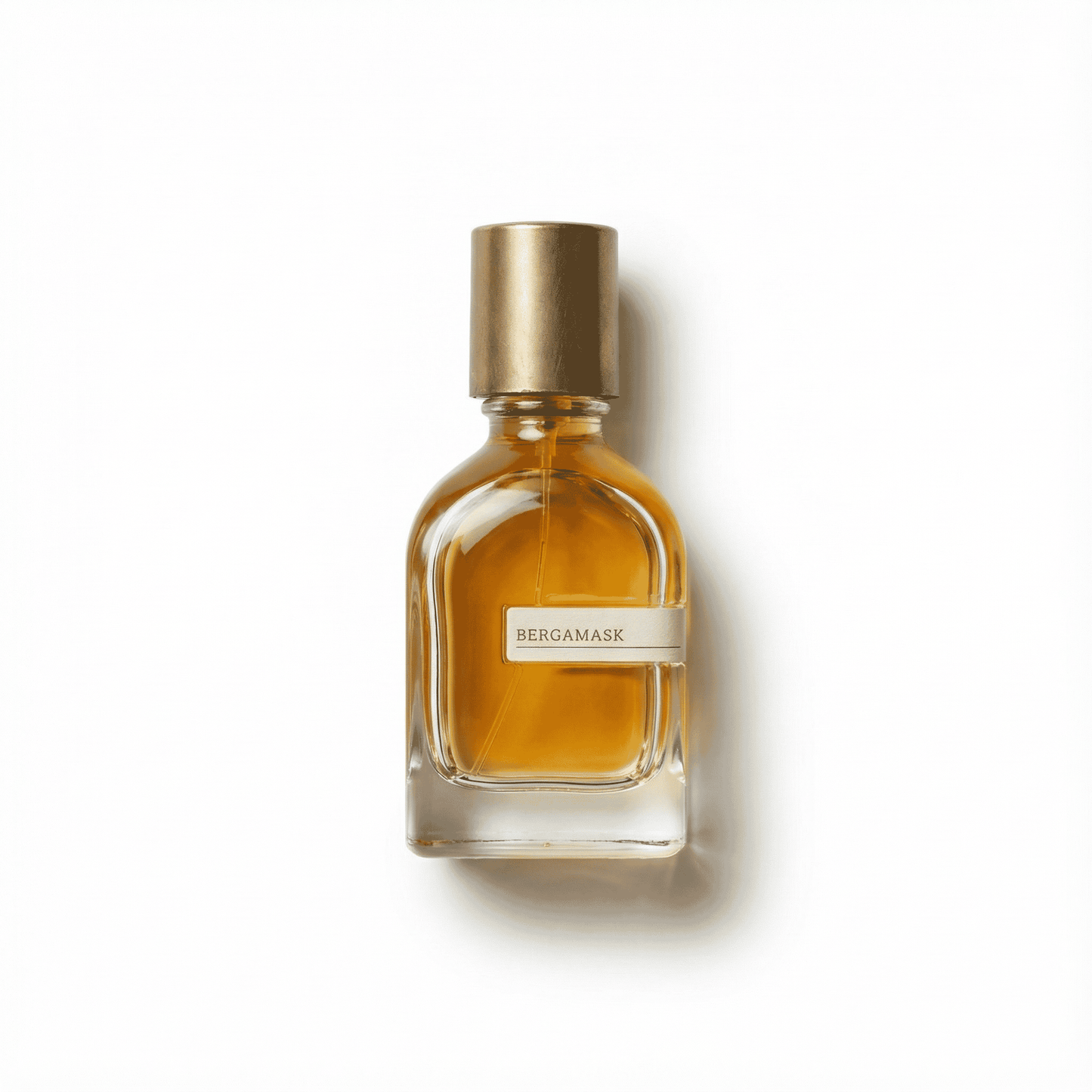 Elegant bergamask essential oil in a clear glass bottle with a gold cap, ideal for aromatherapy and wellness.