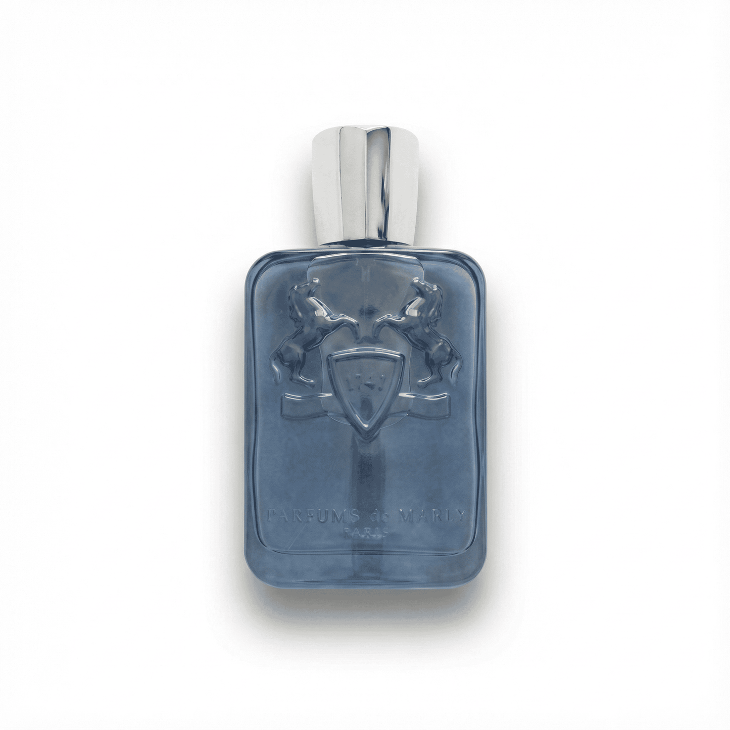 Luxurious men's perfume bottle with embossed heraldic design on a sleek blue glass surface.